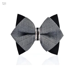Detailed view of the sparkling rhinestone center piece and houndstooth bow tie fabric texture.