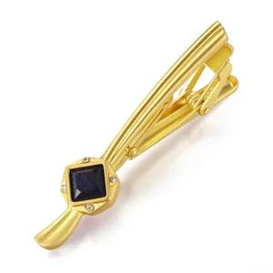 Gold-toned men's tie clip featuring a sparkling blue center stone and white crystal accents.