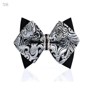 Black and silver patterned bow tie with rhinestone center buckle, elegant men's formal accessory