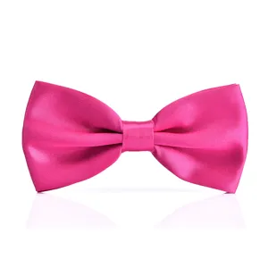 Close-up detail of bright pink satin bow tie, smooth shiny texture for formal wear.