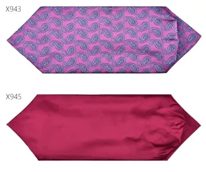 Detailed view of men's neckwear silk scarf with paisley pattern and solid wine red finish.