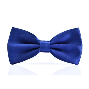 Detail shot of a classic royal blue satin bow tie for men, smooth formal wear accessory.