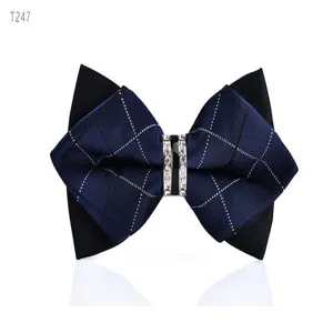 Detail view of a men's double layer crystal bow tie, elegant navy plaid fabric design.