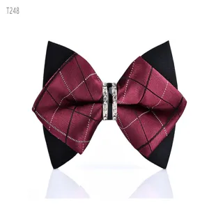 Detailed view of the men's double layer pointed bow tie with red plaid and crystal rhinestone buckle.