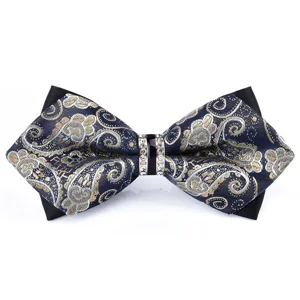Mens pointed bow tie with intricate paisley pattern and sparkling crystal center buckle for weddings.