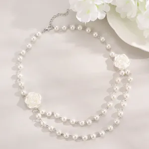 Double layer faux pearl necklace with white rose flower pendant, elegant fashion jewelry.