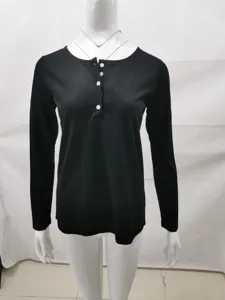 Close-up detail of the black long-sleeve Henley top with front buttons and slim fit design.