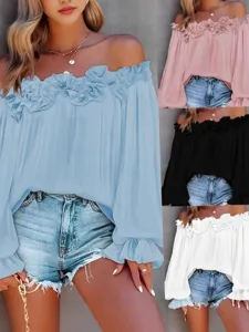 Dettaglio top spalla scoperta con volant maniche lunghe, stile moda vacanza unito.