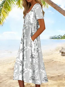 Sommerliches Freizeit-Midikleid mit kurzen Ärmeln, Knöpfen und grauem Blattprint.