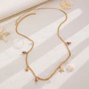 Bohemian gold waist chain with seashell starfish and pearl pendants for beach dress styling.
