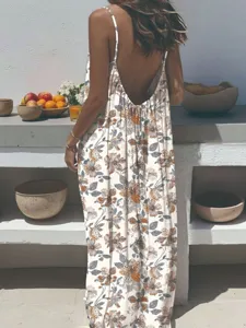 Close-up back view detail of bohemian floral spaghetti strap maxi dress with open back.