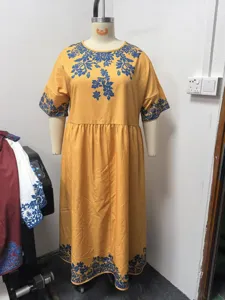 Boho long sleeve midi dress with blue floral print, casual round neck yellow dress