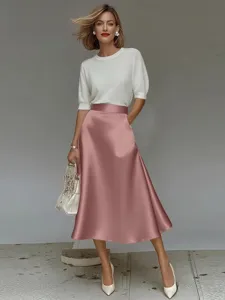 Detailed view of the smooth satin A-line midi skirt showcasing elegant drape and premium fabric.