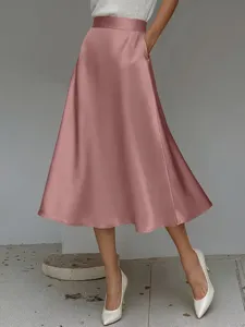 Detailed shot of elegant satin a-line midi skirt, smooth fabric texture and high waist.