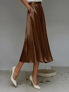 Detail view of the elegant brown satin midi skirt featuring a smooth A-line silhouette.