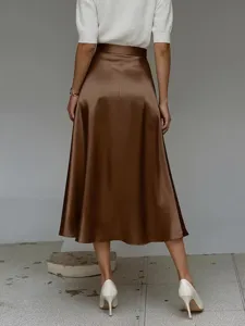 Detailed back view of the elegant brown satin midi skirt showing smooth and glossy fabric texture.