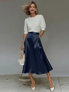 Elegant smooth satin A-line midi skirt featuring a chic high waist and flowing drape silhouette.