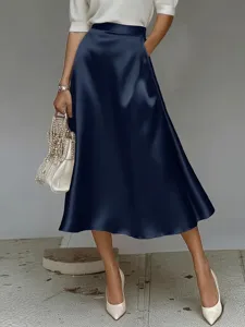 Elegant dark blue satin A-line midi skirt for women, chic commuting office wear.