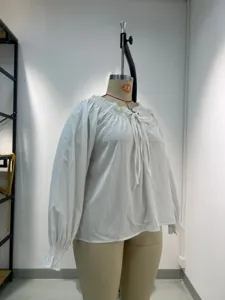 White long sleeve blouse for women with ruffle collar, tie front, and casual loose fit.