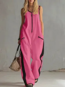 Tuta rosa senza maniche a gamba larga con zip frontale e dettagli di strisce laterali.