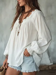 White V-neck lace-up ruffle long sleeve loose casual blouse detail shot for autumn wardrobe.