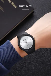 SKMEI minimalist quartz watch with black strap and silver dial for men daily wear.