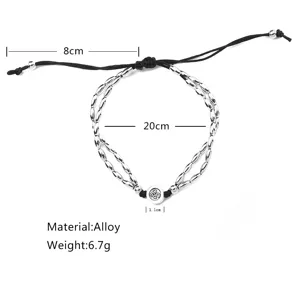 Elegante bracciale a doppio filo in perle di lega con pendente yoga Om e cordino regolabile.