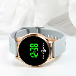 Round LED electronic watch with rose gold case and grey silicone strap for daily wear.