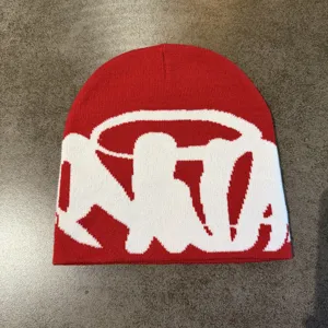 Red knitted beanie winter warm streetwear short cap with stylish jacquard design.