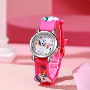 Close-up of cute pink kids quartz watch with 3D unicorn strap and clear dial numbers.