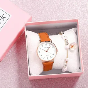 Set de regalo de reloj de cuarzo para estudiantes con correa fina de cuero marrón y números claros.