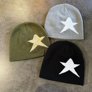 Detailed view of women's autumn winter knit beanie hats featuring stylish star jacquard patterns.
