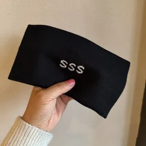 Wide black knit headband with white SSS letters, cozy winter warm hair hoop for daily wear.