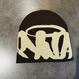 Detailed view of the streetwear knit beanie featuring stylish jacquard letters for winter.