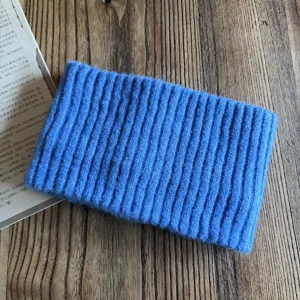Blue knitted wool headband detail, warm wide winter hair accessory for women daily.