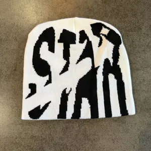 Black and white knit beanie with bold letter pattern, streetwear style winter warm hat.