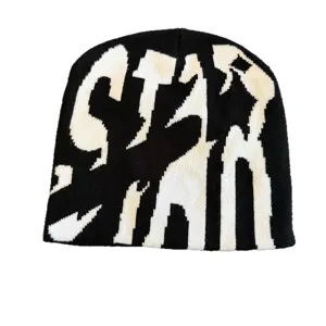 Black and white knit beanie featuring bold gothic letter design, stylish streetwear winter hat.