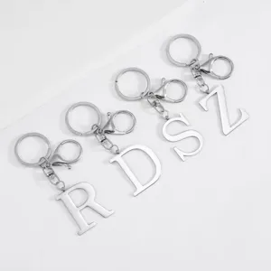 Stainless steel uppercase letter keychain detail, stylish silver alphabet pendant keyring.