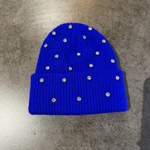 Blue rhinestone knit beanie detail, stylish winter warm casual street style hat for women.