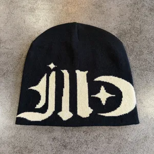 Black streetwear knitted beanie with contrast gothic graphic pattern for autumn and winter warmth.