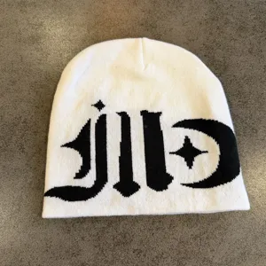 Streetwear gothic knit beanie hat for men and women, warm black and white colorblock design.