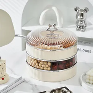 Boîte de rangement transparente multicouche pour snacks avec couvercle étoile élégant.