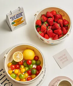 Double layer draining basket fruit washing basin kitchen colander strainer with handle and fresh fruit.