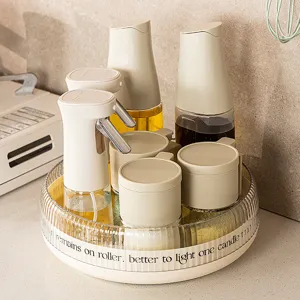 Multi-functional rotating kitchen spice rack organizer turntable with oil bottles and jars.