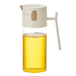 Bouteille d'huile en verre borosilicaté avec couvercle automatique et poignée pour cuisine.