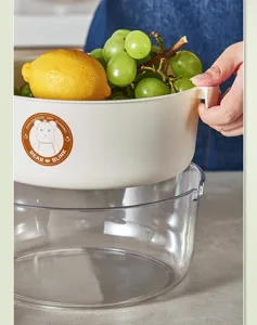 Double layer plastic drain basket for kitchen fruit and vegetable washing, modern design.