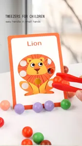 Close-up of wooden bead sorting toy with colorful balls, tweezers, and lion learning card.