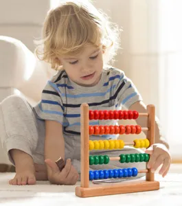 Detailed lifestyle view of a wooden abacus toy with colorful beads for kids math learning.
