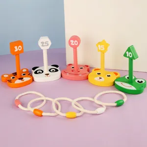 Kids wooden ring toss game with cute animal bases and number targets for early education.