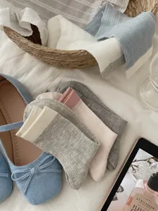 Detail view of women's thin breathable cotton mid-tube socks in stylish colors. Soft and comfortable.